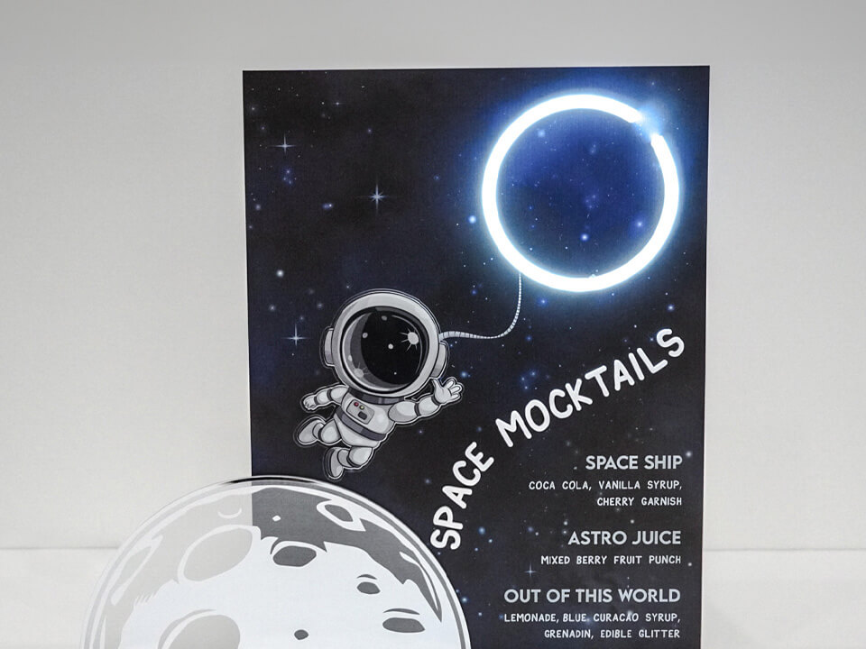 Custom printed acrylic menu with an outer space theme.