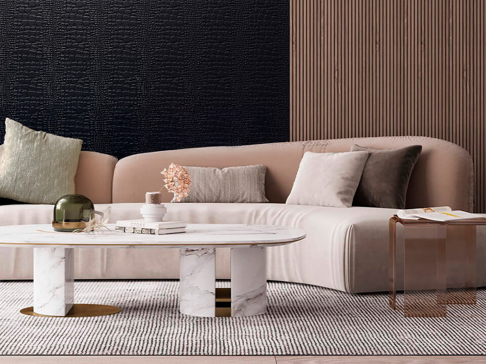 Sofa and table with textured wall coverings in the background.